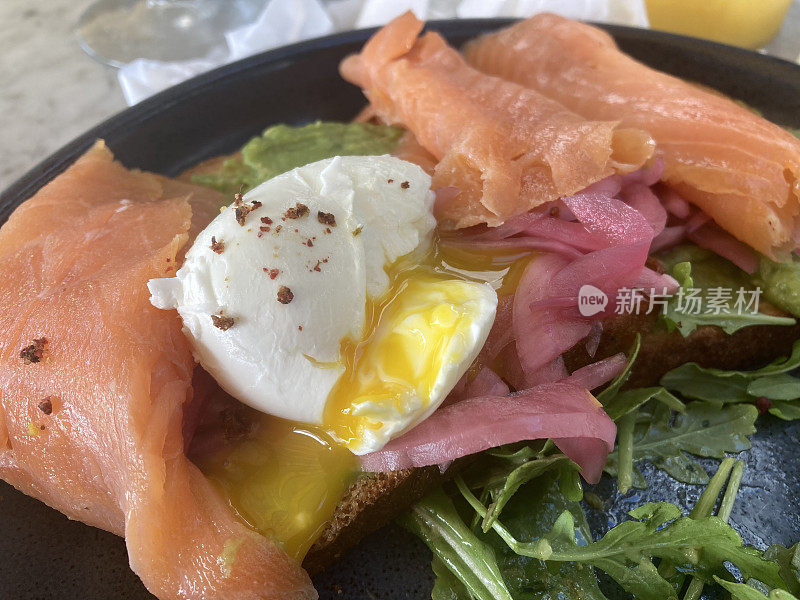 United States -- Food -- Avocado toast with avocado, smoked salmon, and eggs